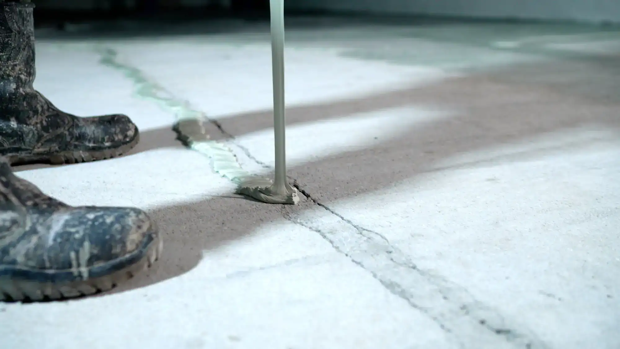 Basement crack repair in Montgomery County, Pennsylvania, showing a technician sealing a foundation wall crack to help prevent water intrusion and structural damage