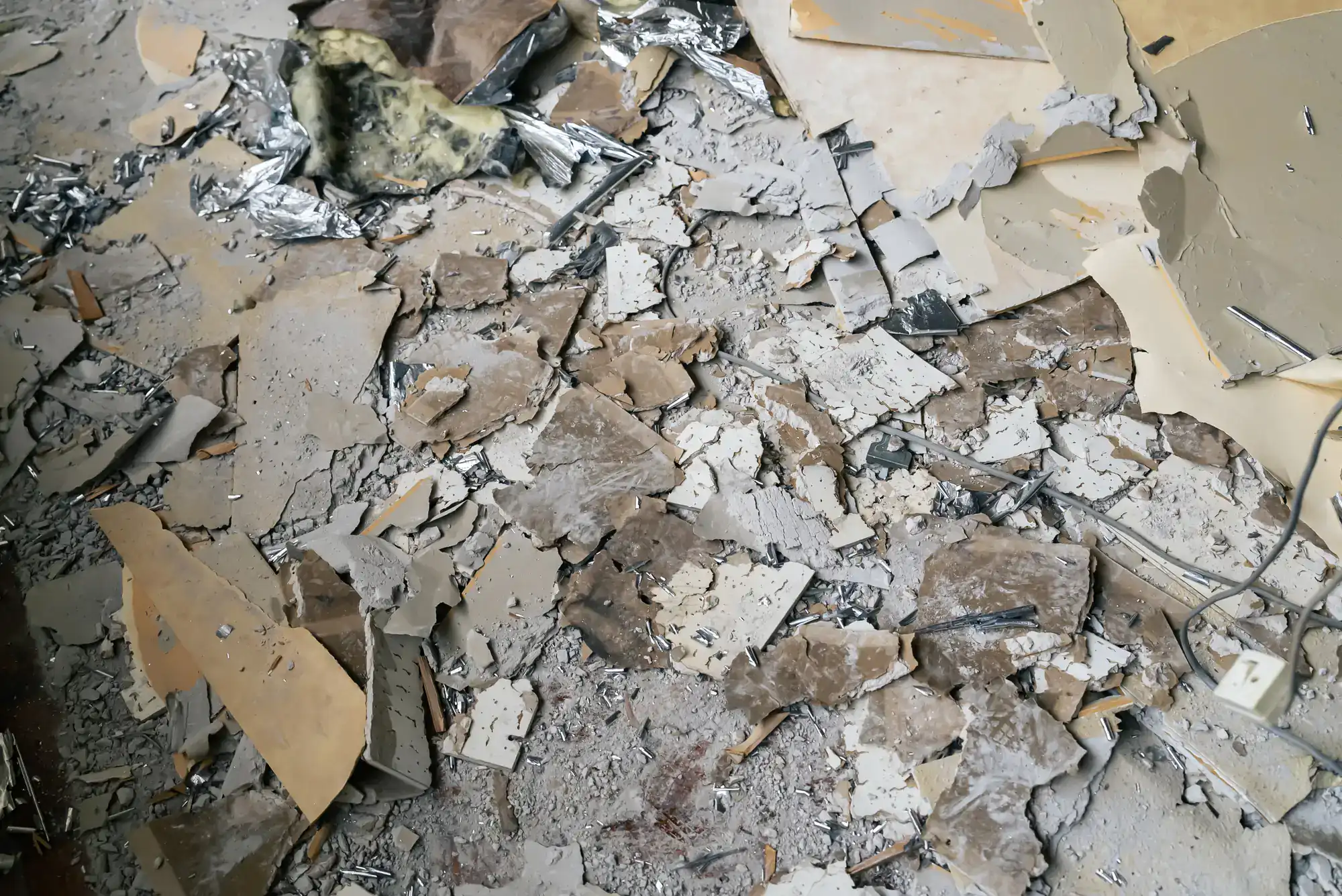 Building debris and floor rubble inside a damaged property in Montgomery County, Pennsylvania