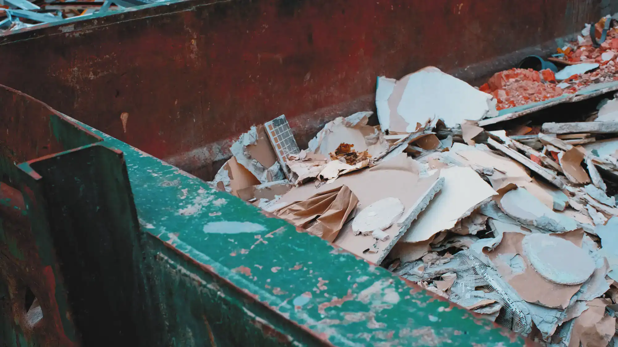 Demolition debris dumpster on a Montgomery County, Pennsylvania job site filled with construction waste and renovation materials
