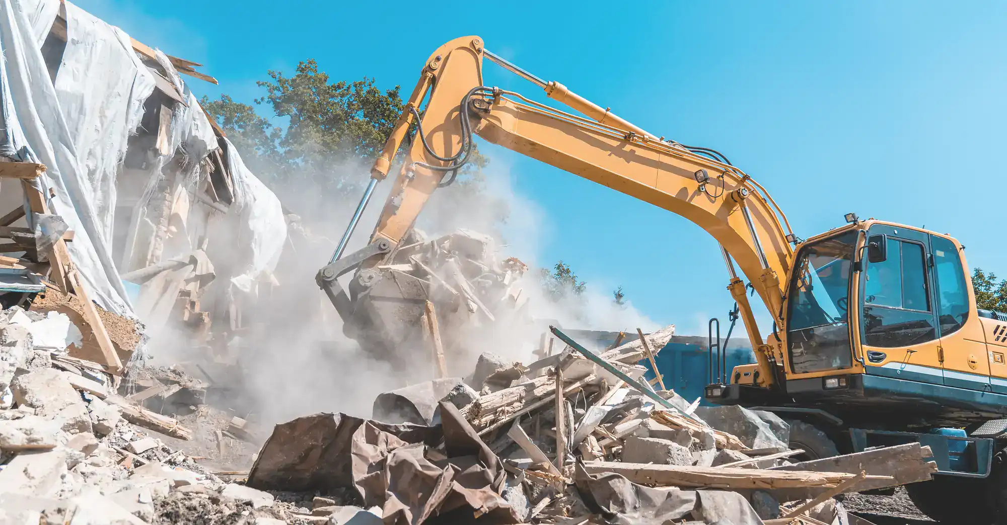 Excavator tearing down a structure during demolition work in Montgomery County, Pennsylvania