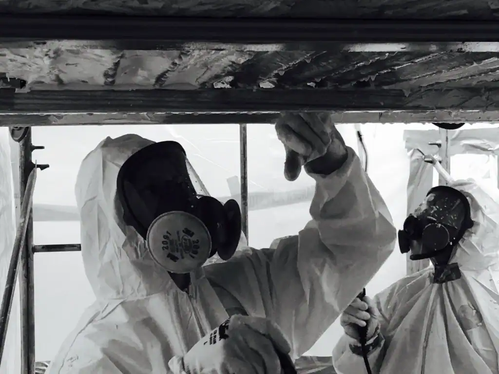 Workers in hazmat suits performing hazardous material cleanup at a property in Montgomery County, Pennsylvania